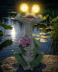 iStatue Solar Frog Garden Statue with Blinking Light-Up Eyes, Resin Outdoor Garden Decor Frog Holding Flowers, Waterproof Animal Figurine for Patio Lawn Yard Porch Balcony (Green) by iStatue