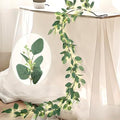 6FT Eucalyptus Garland with Lights, 96 LED Artificial Silver Dollar Eucalyptus Vine with Flowers, 8 Modes Timer Battery Operated Lighted Greenery Garland for Wall Bedroom Wedding Farmhouse Home Decor by HamiFinee