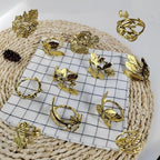 Bakayoyo Elegant Vintage Gold Herb Napkin Rings Set of 12 - Glossy Leaf Napkin Holders, Metal Table Adornment for Christmas, Thanksgiving, Weddings & Holiday Parties by Unknown