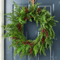Glitzhome 24" D Christmas Wreath for Front Door, Real Touch Green Artificial Cedar Wreath with Red Berries for Porch, Window, Wall Indoor and Outdoor Home Decor by Glitzhome