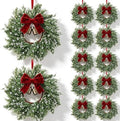 12 Set Christmas Hanging Wreaths Small Snow Flocked Artificial Cedar Wreaths with Red Velvet Ribbon Bronze Bells Mini Faux Greenery Wreath for Front Door Porch Cabinet Window Xmas Holiday Decorations by Unknown