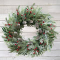 24 Inch Snow Flocked Christmas Wreath with Pine Cones & Red Berries by Montekin