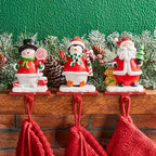Glitzhome Christmas Stocking Holders, Set of 3 Santa Snowman Penguin Mantel Decor with Weighted Base, Festive Jack-in-The-Box Design for Fireplace, Holiday Sock Hangers - Image 2
